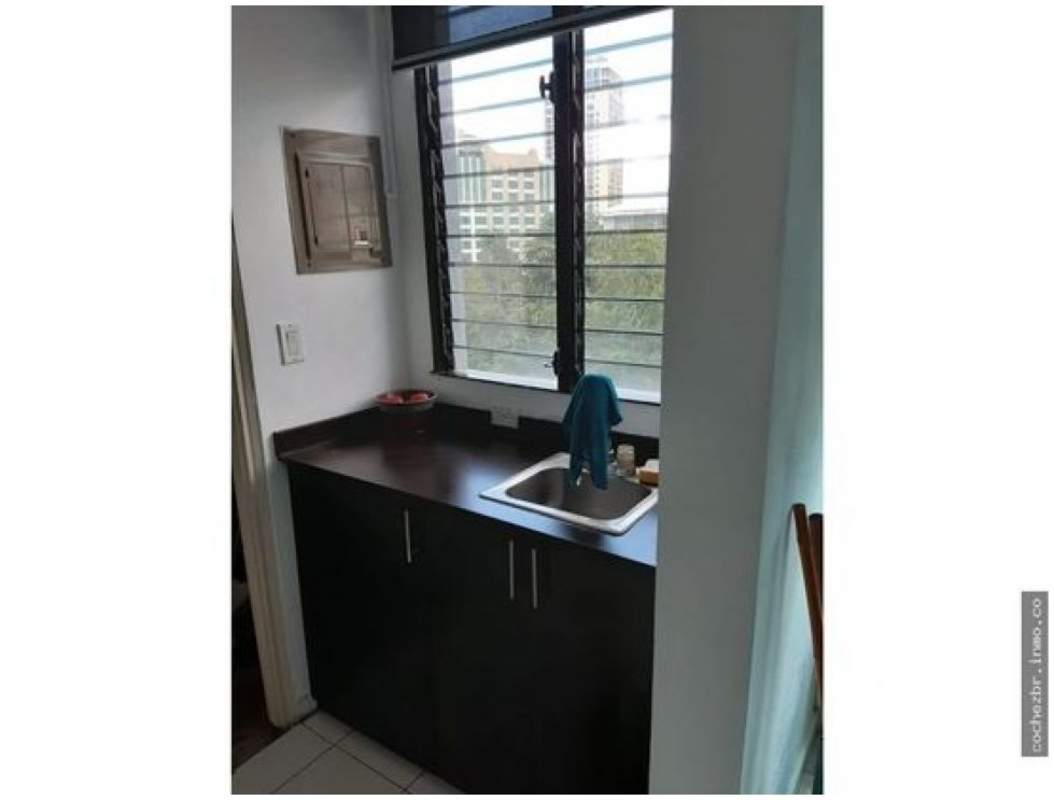 Compact kitchenette with window and minimal decor in PH Global Plaza Calle 50 Obarrio Panama City