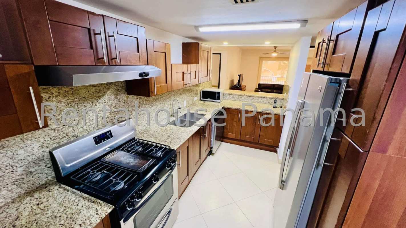 Outdoor covered terrace overlooking gardens at Embassy Club Clayton Panama