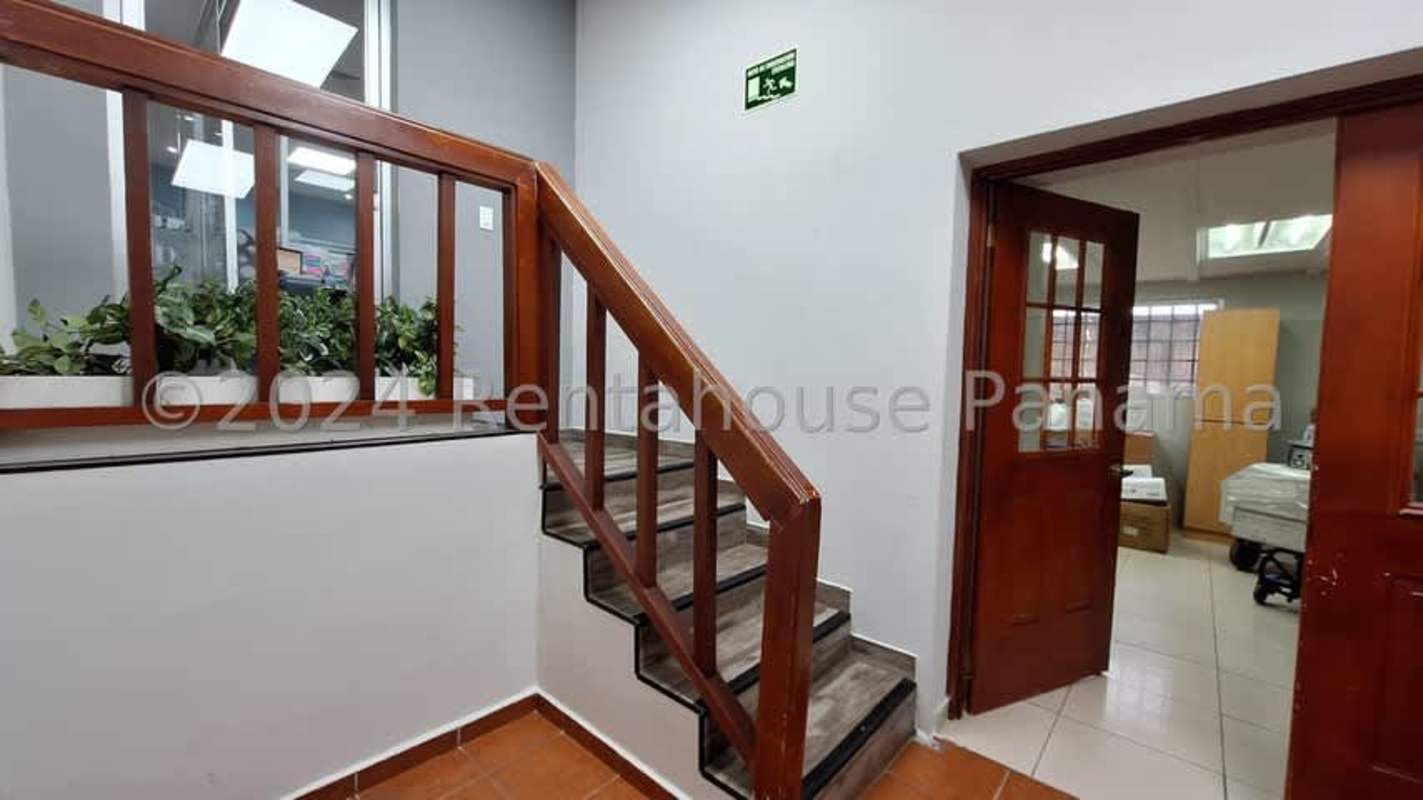 Reception entrance with staircase and glass partitions commercial building for sale San Francisco Panama