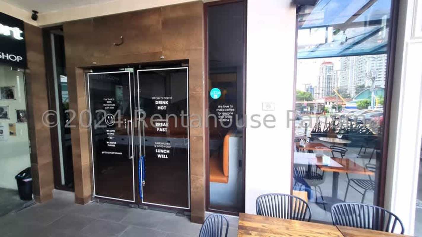 Spacious indoor dining or retail area with bright mural, exposed ceilings in commercial plaza San Francisco Panama