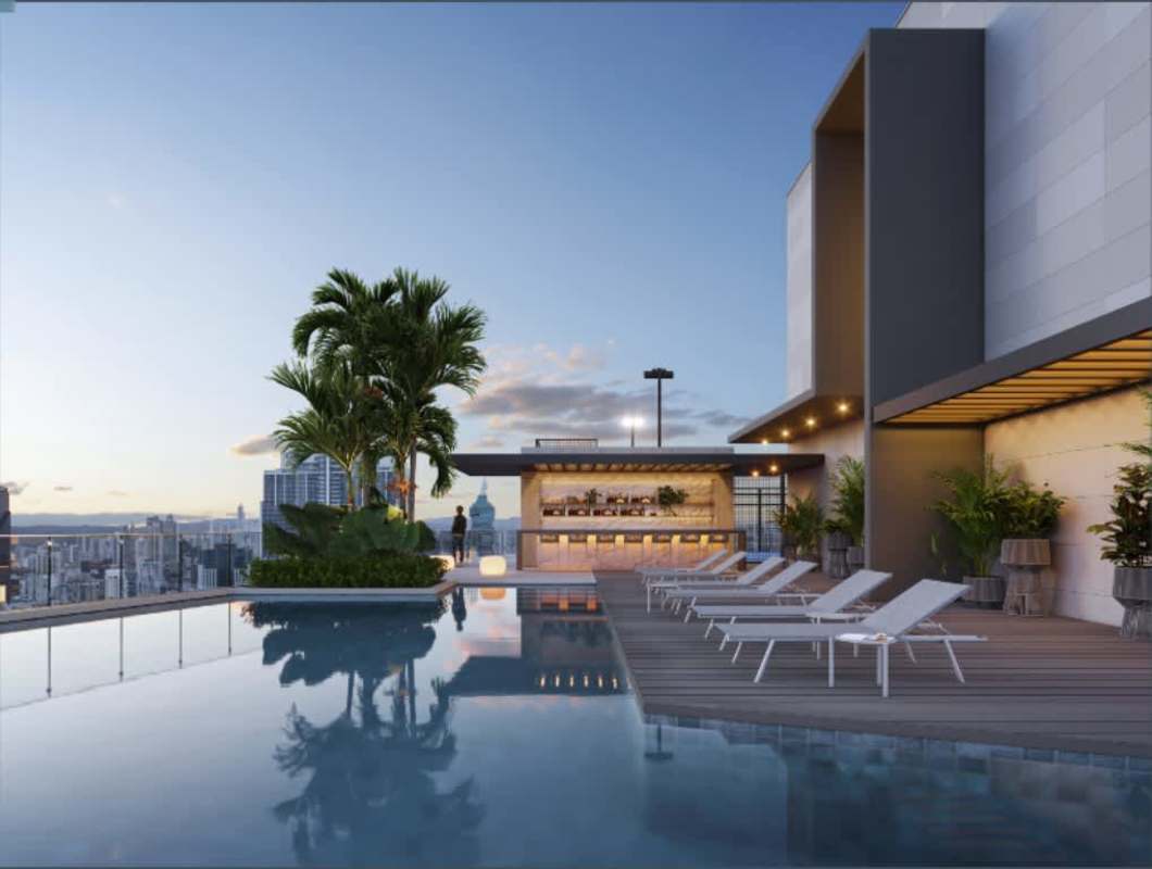 Rooftop infinity pool with lounge area and panoramic ocean skyline view in luxury condo Panama City Punta Paitilla