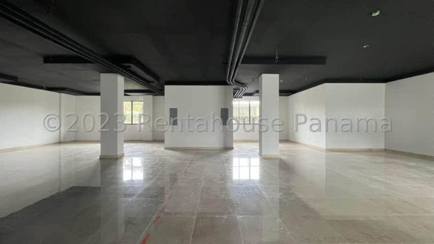 Spacious open retail or office space with exposed ceiling and polished tile floor in PH Plaza San Francisco