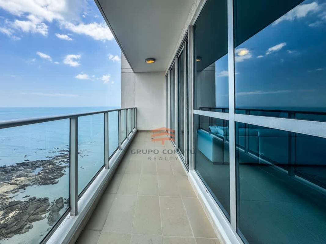 Open kitchen featuring granite countertops and stainless appliances PH Oceanaire