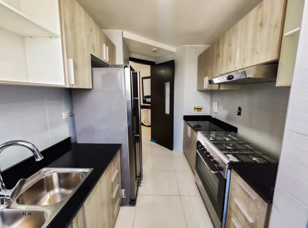 Kitchen with granite countertops, modern cabinetry, appliances at PH Cosmopolitan Tower Panama