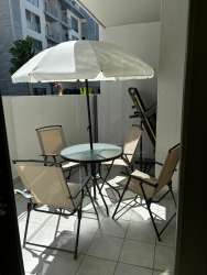 Balcony area with patio furniture in furnished apartment PH Mosaic Howard Panama