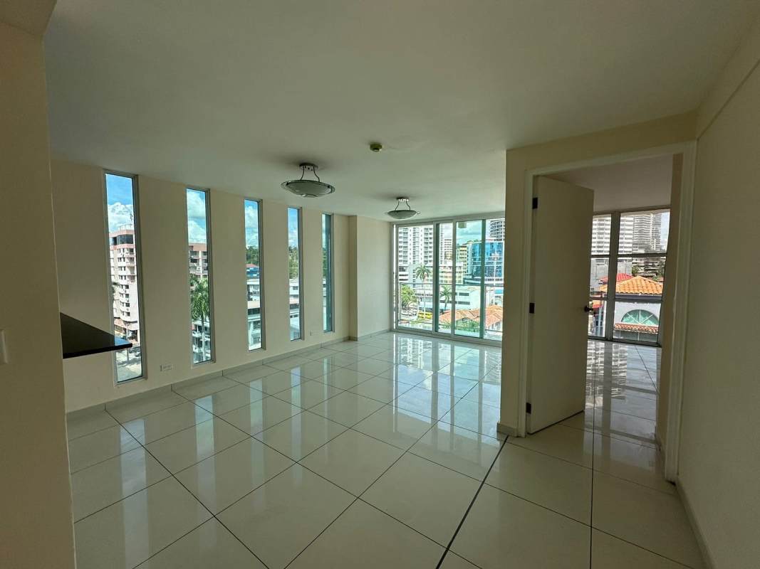 Floor to ceiling windows in bright modern living room open city views PH Bella Vista Panama