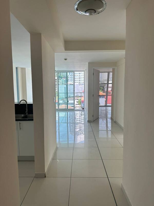 Bedroom featuring large window city view white built-in closets porcelain tiles PH Bella Vista Panama