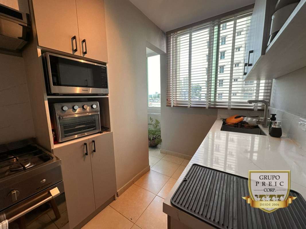Dining space with glass table and city views PH El Cangrejo Panama City