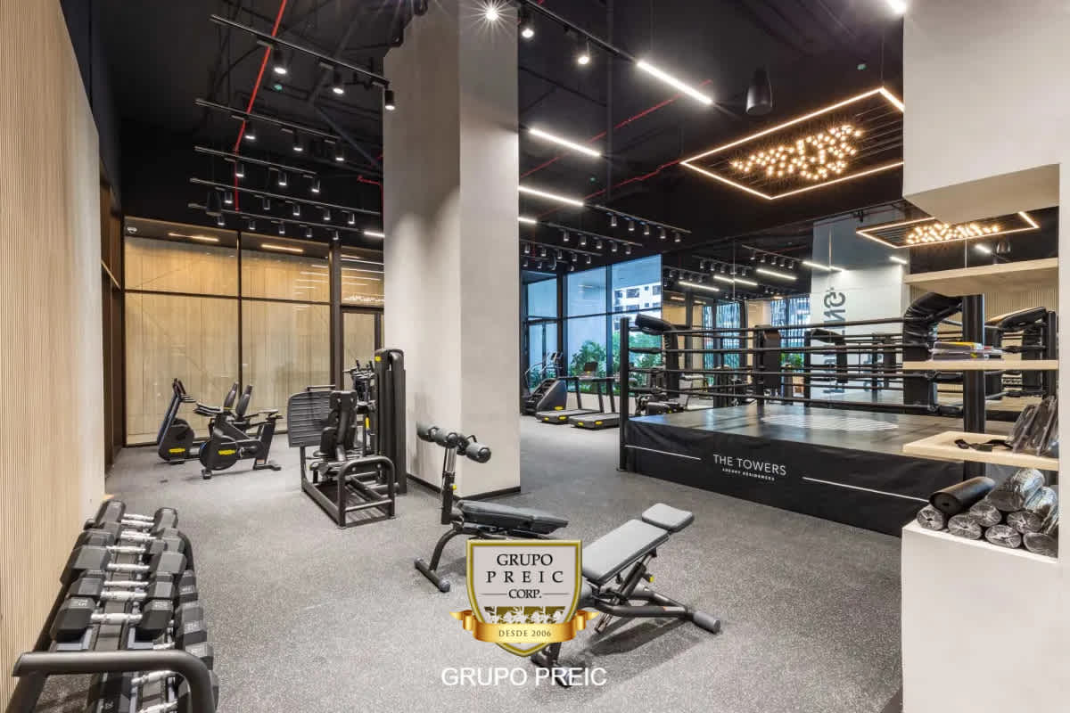 Outdoor children's playground at PH The Towers with colorful slides and climbing equipment