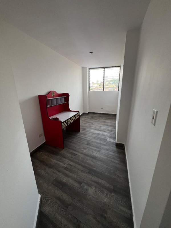 Kids bedroom with large window, racing car bed, wood floor PH Miraflores Tower Panama