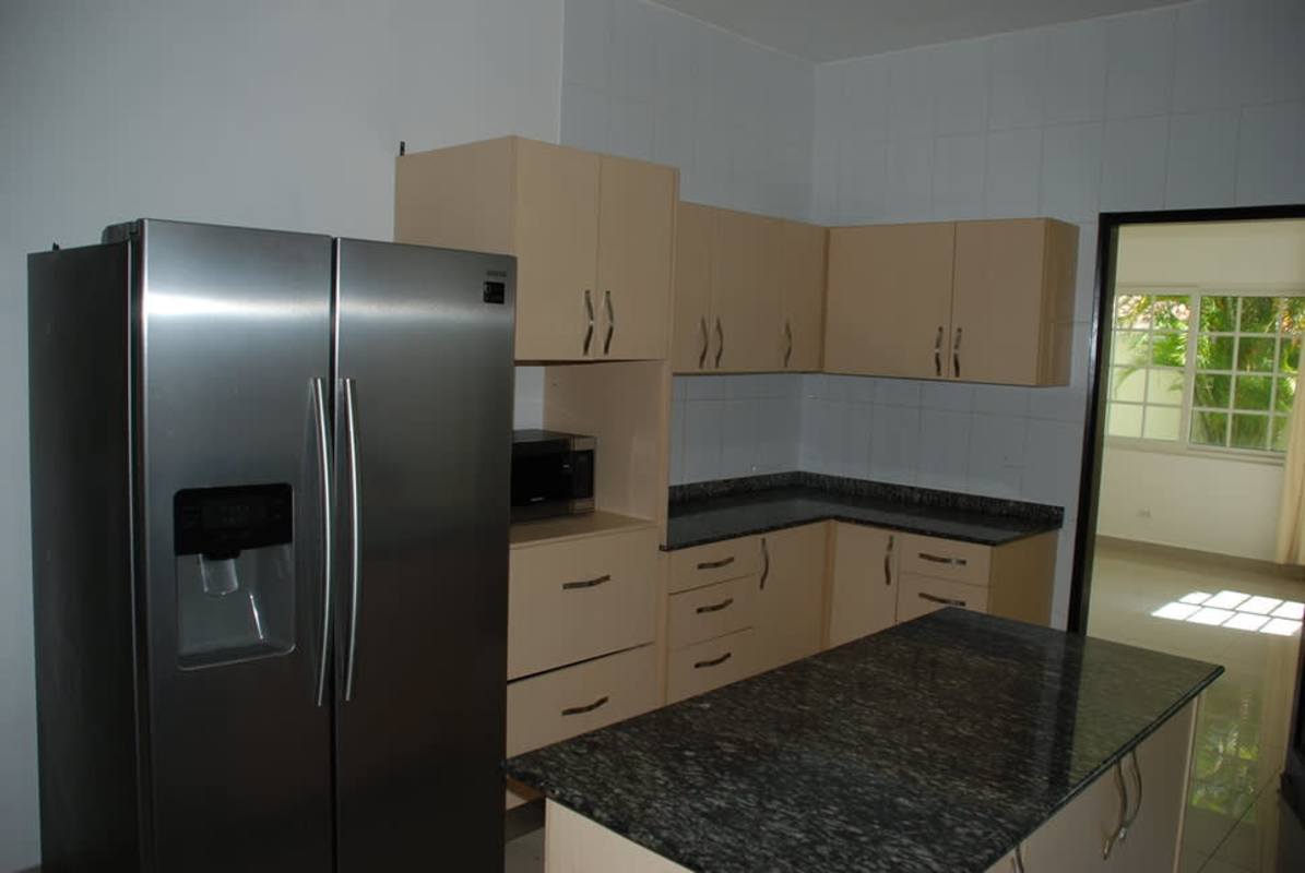 Bright staircase landing with metal railing and chandelier Costa Sur house for sale