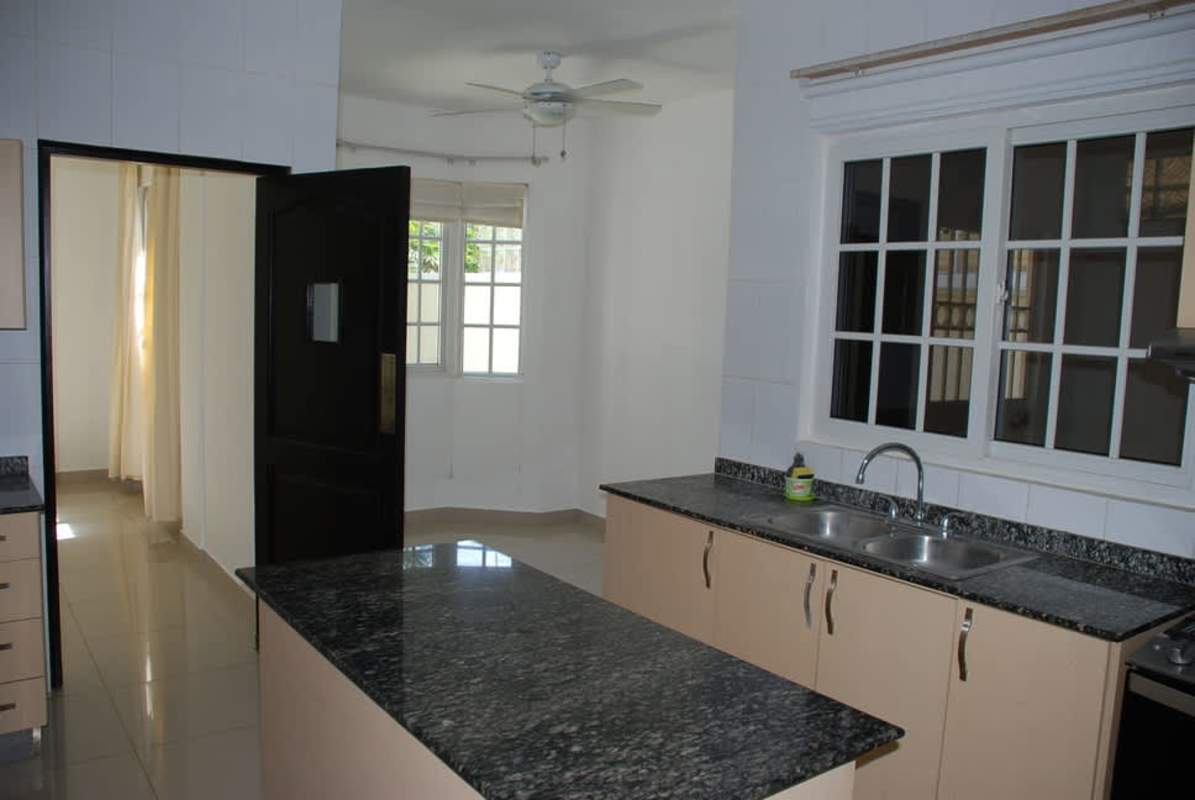 Gourmet kitchen with granite countertops, island and modern appliances Costa Sur Panama