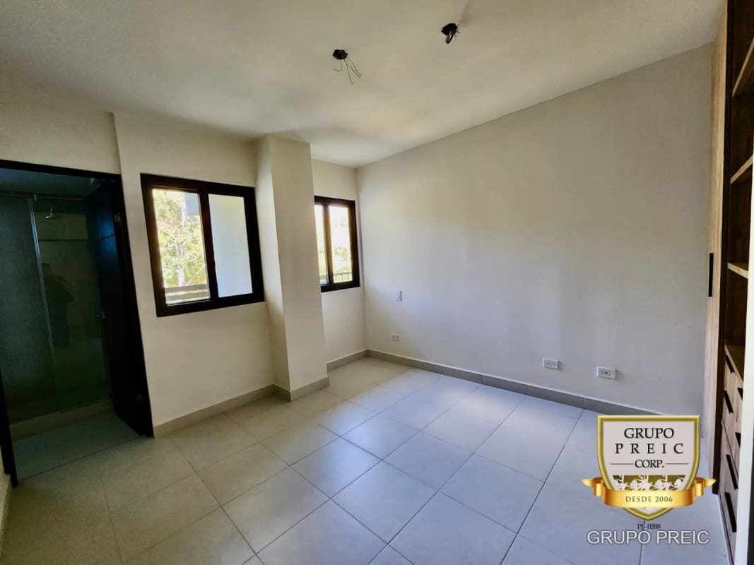 Bedroom with closet window garden view PH Embassy Village Clayton Panama