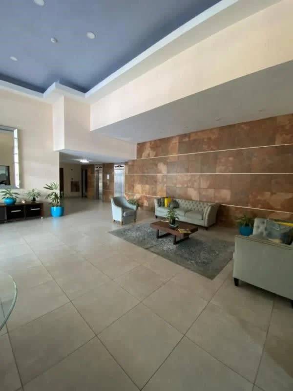 Balcony with metal furniture overlooking Panama city skyline PH Solaris