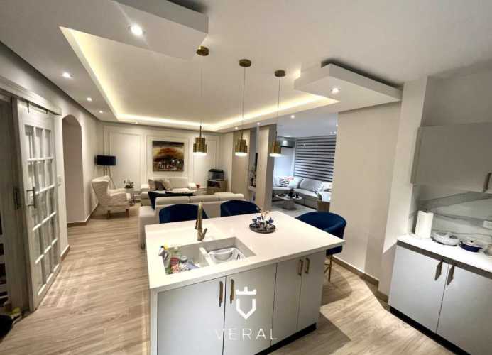 Contemporary kitchen with granite counters breakfast island Lyon Model house in Versalles Costa Sur Panama