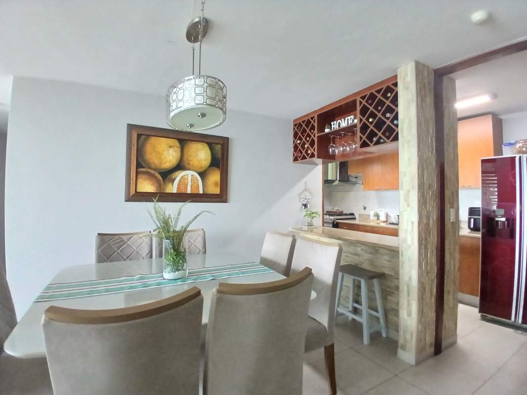 Modern granite countertop kitchen with breakfast bar and appliances in PH Terrawind San Francisco Panama City