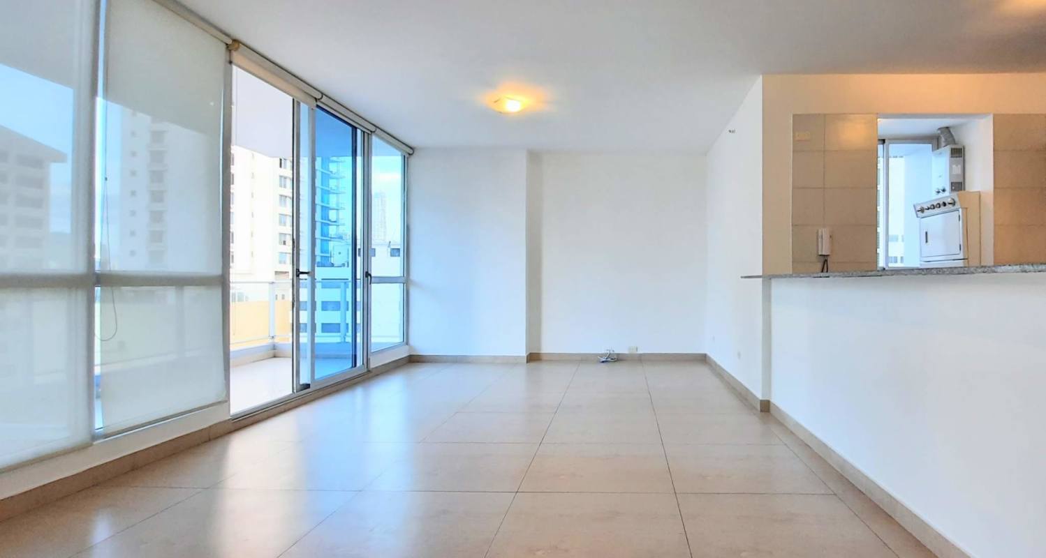 Bright living dining room with balcony and ocean skyline view at Vista del Mar
