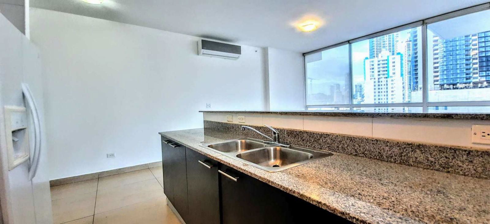 Kitchen with granite countertops and panoramic windows Vista del Mar Panama