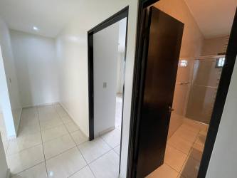 Bathroom with modern tiles pedestal sink glass shower enclosure rental home David Panama