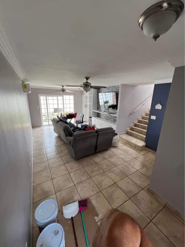 Living area with sectional sofa, TV and ceramic floors in PH Everest Brisas del Golf