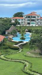 Large swimming pool with gardens Punta Barco Village beach community