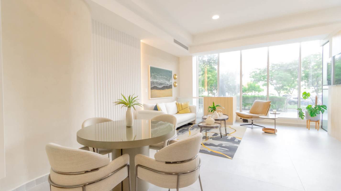 Modern open concept living dining space with city views in Seaside Panama