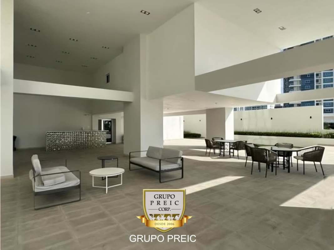 Modern condominium high-rise PH Lumiere in Costa del Este Panama with palm trees