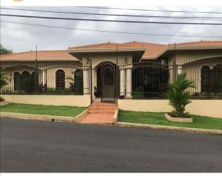 Private in-ground pool with surrounding tiled deck, garden and fence in Talavera La Chorrera Panama
