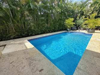 Private swimming pool with sun terrace lush gardens luxury villa for rent at Tucan Country Club Panama