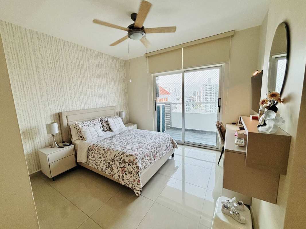 Spacious bedroom with balcony access, neutral tones in Quartz Tower Coco del Mar Panama