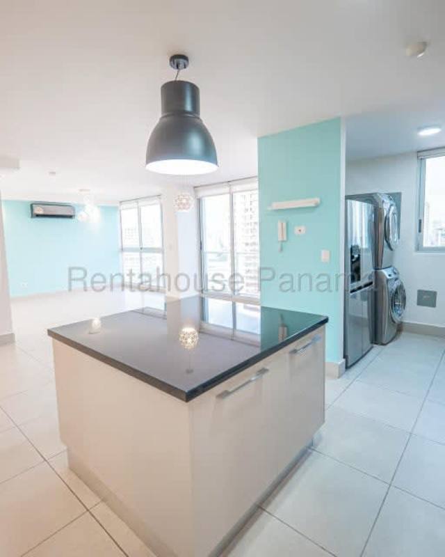 Open kitchen with granite counters and appliances at Sortis Tower Obarrio Panama City