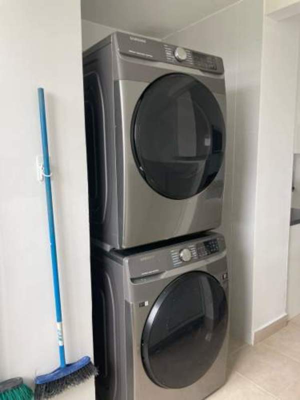 Stylish kitchen with white cabinets and stainless appliances PH Clayton Park Panama City