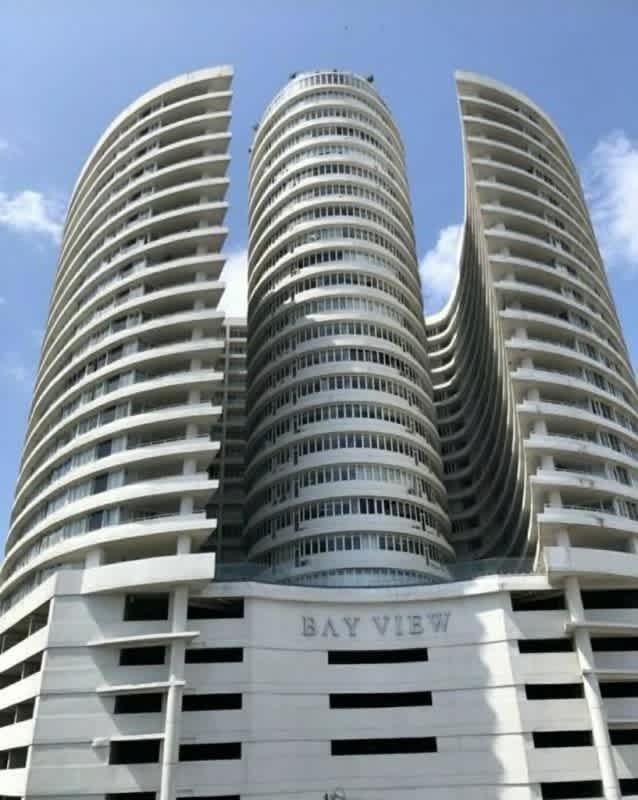 Bright living dining area with large windows balcony access in PH Bay View Panama