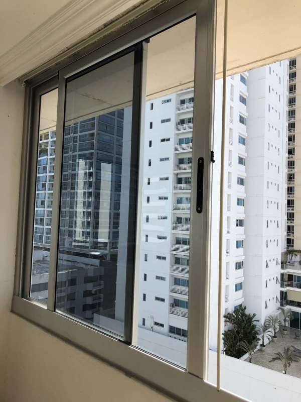 Facade of PH Parque Marbella with decorative balconies and green garden Panama City