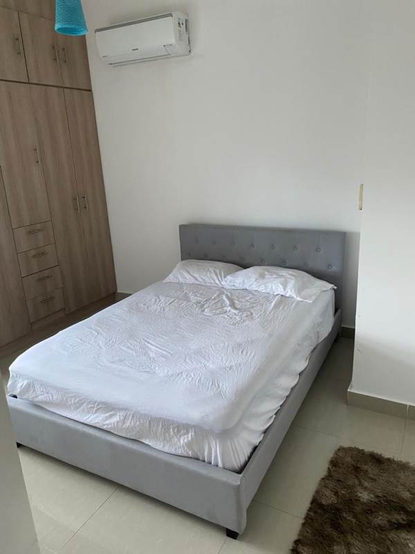 Furnished bedroom with built-in closet AC and noise-insulated window at PH Rainbow Tower Panama