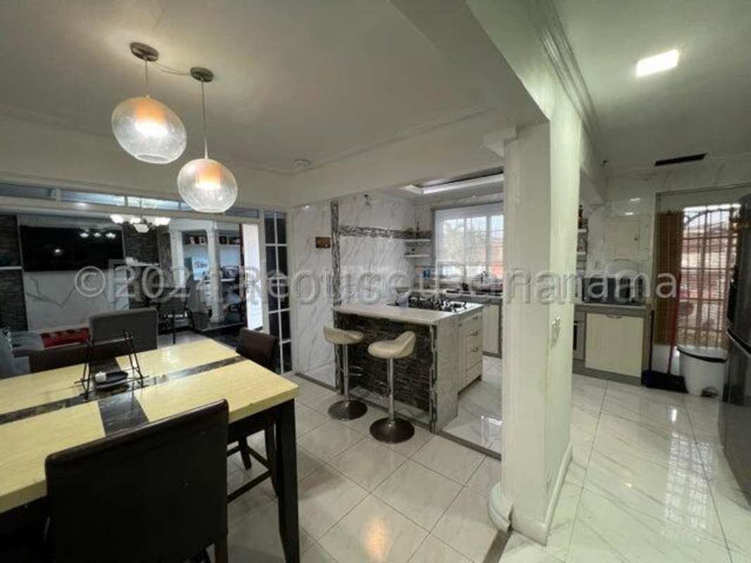 Dining area with pendant lights and breakfast bar Don Bosco neighborhood home Panama