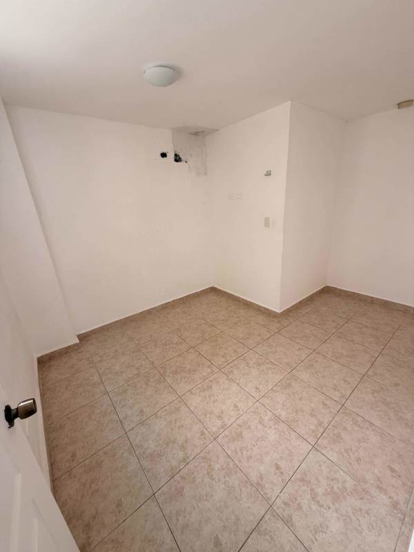 Bedroom featuring built-in wardrobe, split AC, tiled floor in PH Las Acacias Residences Panama