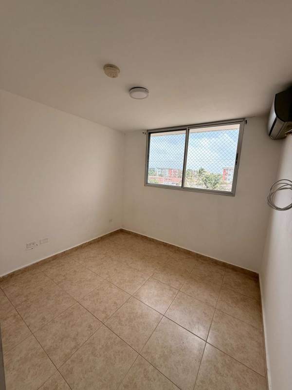 Second bedroom with built-in closet, large window with security mesh PH Las Acacias Panama