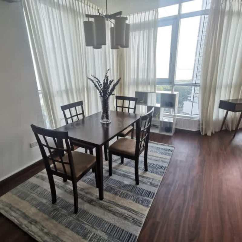 Bright living room with balcony access and ocean views in PH Riverside Costa del Este Panama