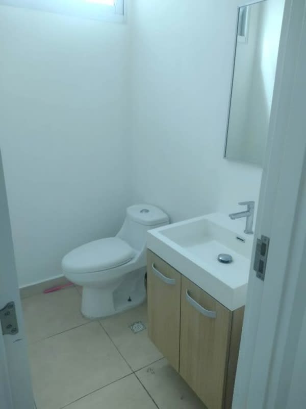 Furnished dining space with partial ocean views balcony access PH Oasis on the Bay Panama