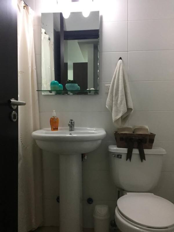 Open kitchen with granite countertops and laundry appliances in PH Top Tower furnished apartment Costa del Este Panama