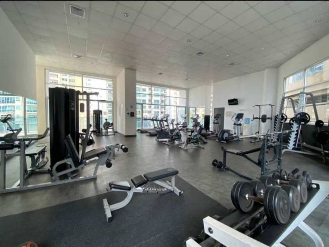 Bright modern gym with weight and cardio equipment in PH Oasis on the Bay Panama