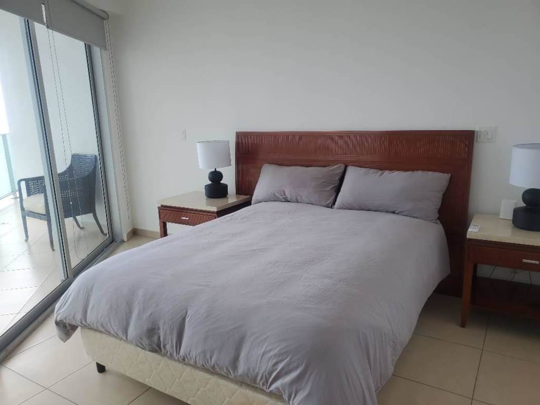 Spacious kitchen with modern cabinetry, granite countertops and appliances in PH Oasis on the Bay