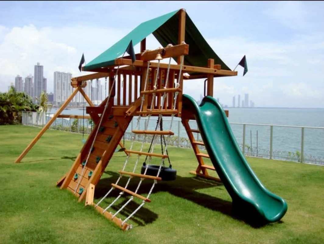 Glass-railed oceanfront balcony overlooking city skyline and Pacific Ocean in Punta Pacifica