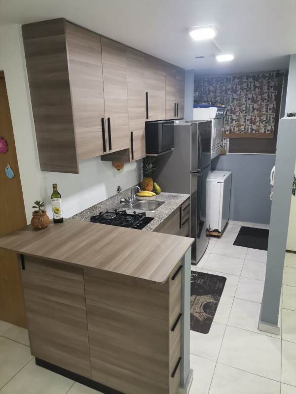 Bright kitchen-dining combination with modern cabinetry in Llano Bonito Panama