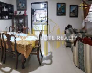 Large dining and living room area with classic décor for sale in Chitré house