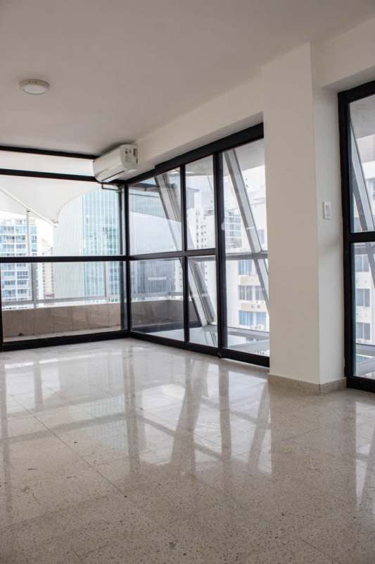Spacious penthouse living room with floor-to-ceiling windows and skyline views PH The Point Panama