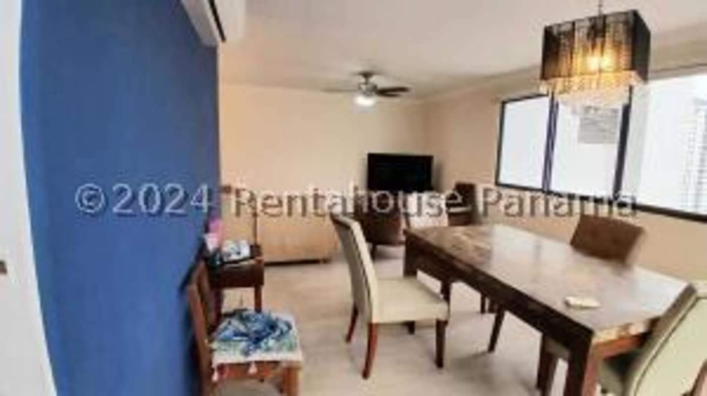 Open living and dining room with large windows PH Country Club Panama