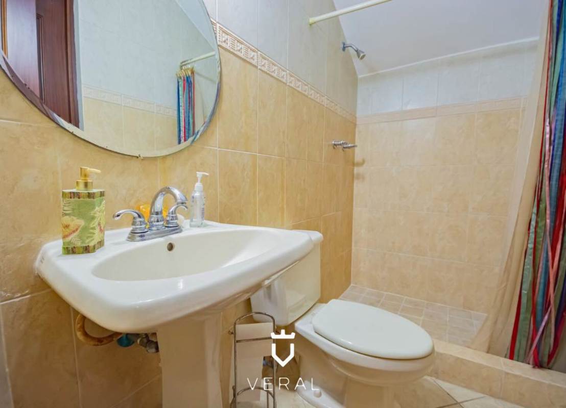 Covered driveway with terracotta roof and Mediterranean columns in luxury house Clayton Panama