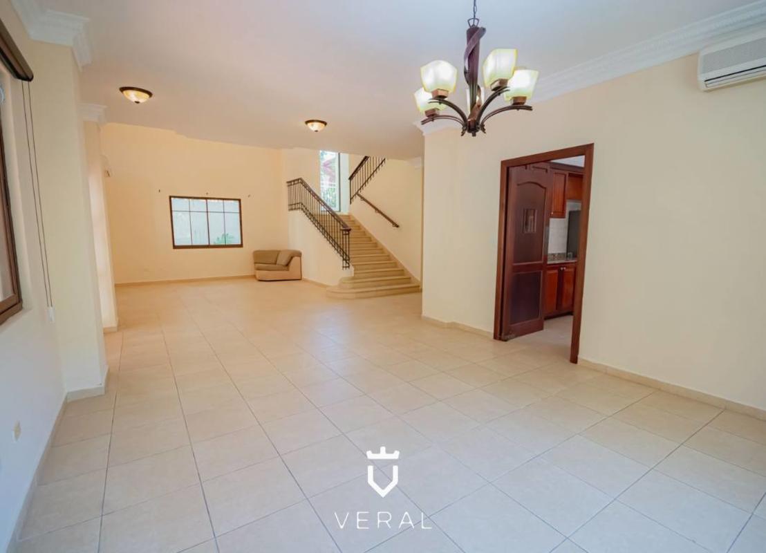 Bathroom with beige tiles, pedestal sink, walk-in shower Clayton Panama